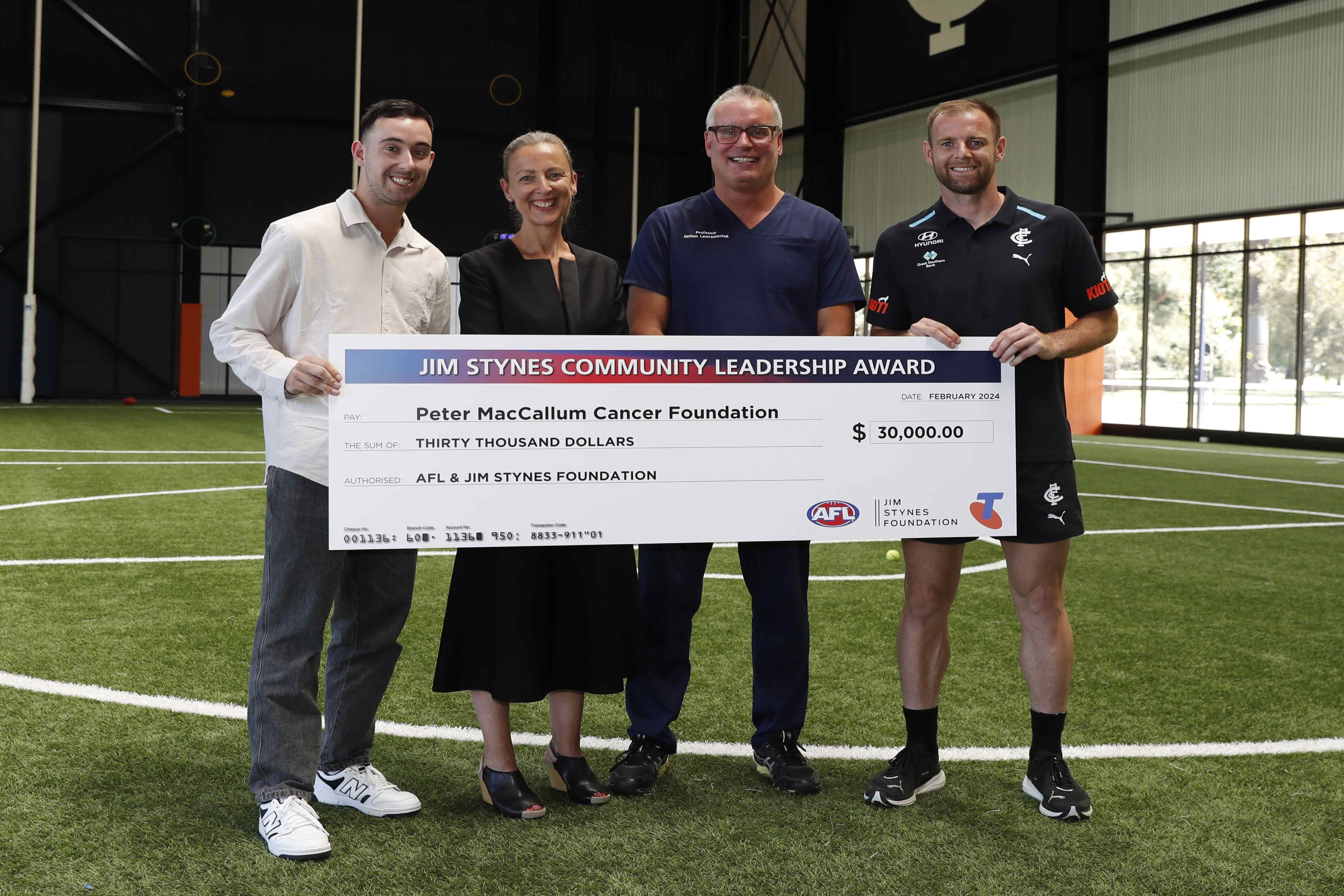 (L-R) Blues supporter and cancer survivor Liam Contarin, CEO of the Peter Mac Foundation, Kate Torney, Prof Nathan Lawrentschuk and Carlton's Sam Docherty. Photo: Sarah Morton/AFL Photos